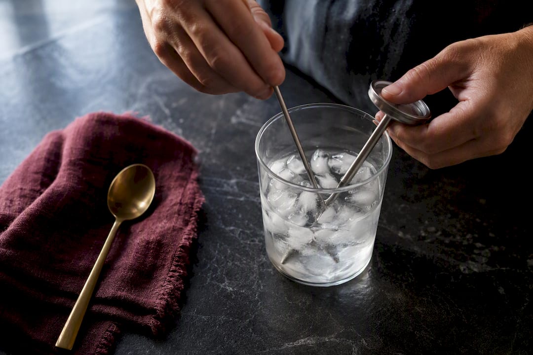 Thermometer probe submerged in ice water