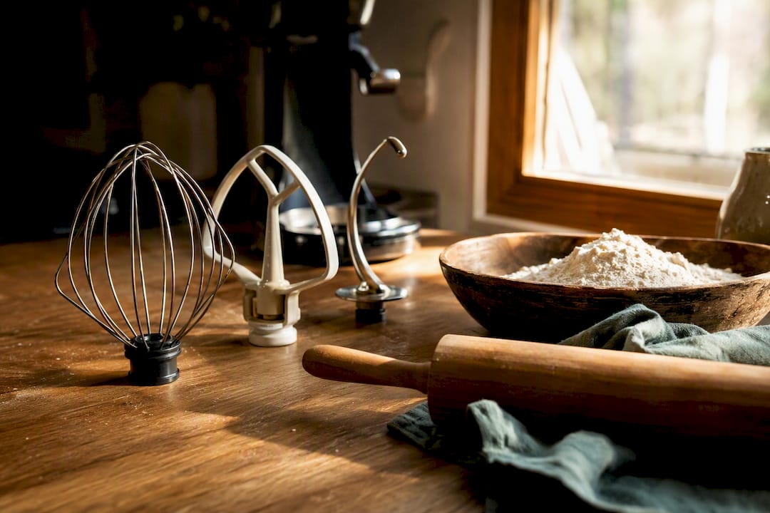 Stand mixer attachments on kitchen counter