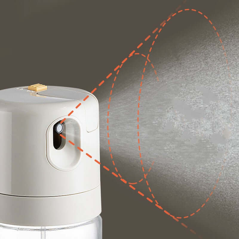 2 In 1 Oil Sprayer Bottle BBQ Cooking for cooking demonstrating its spraying feature with a fine mist of oil.