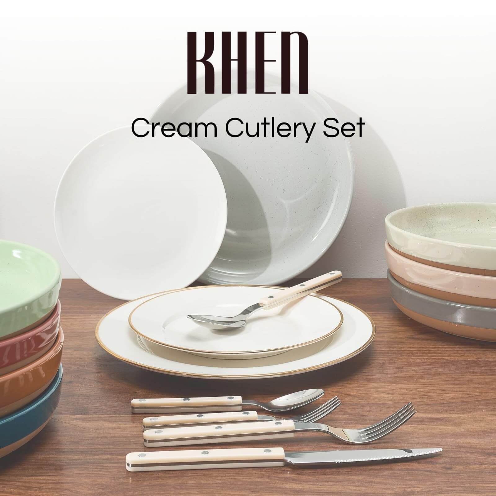 Khen Cream Cutlery Set featuring stainless steel cutlery set with colorful dinnerware on wooden table.
