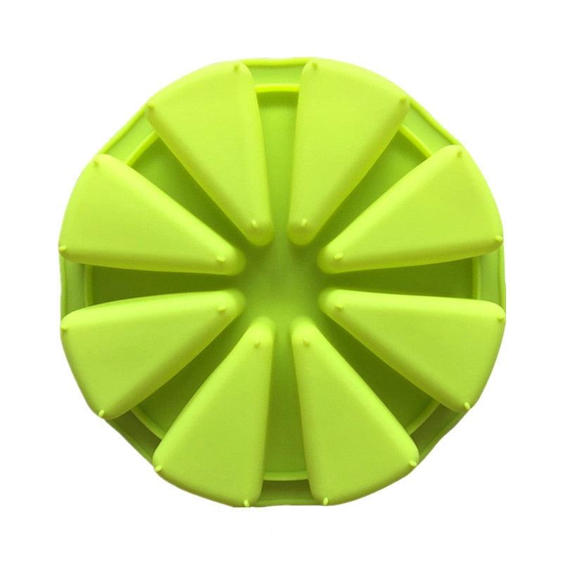 Green silicone lid with triangular sections on a white background