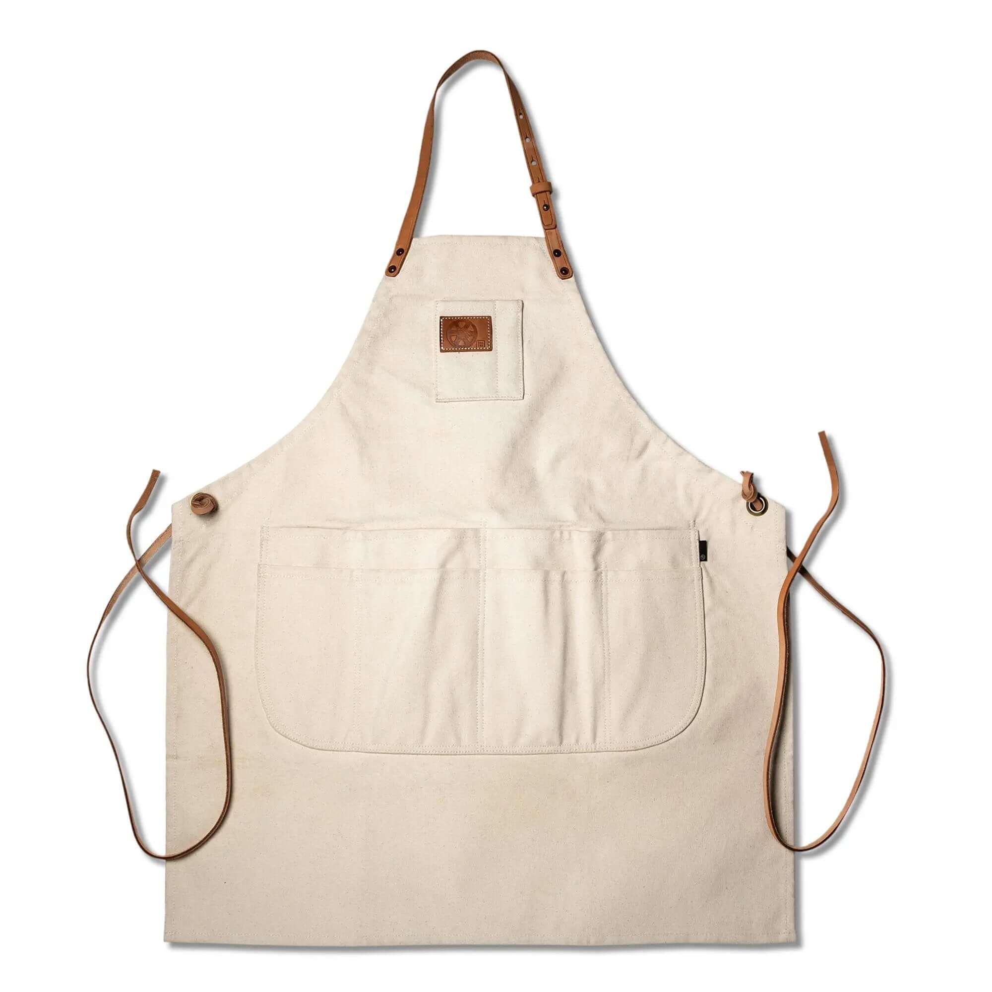 Natural Canvas Apron for Home Cooks with leather straps and multiple pockets for home and garden use, made in the USA.