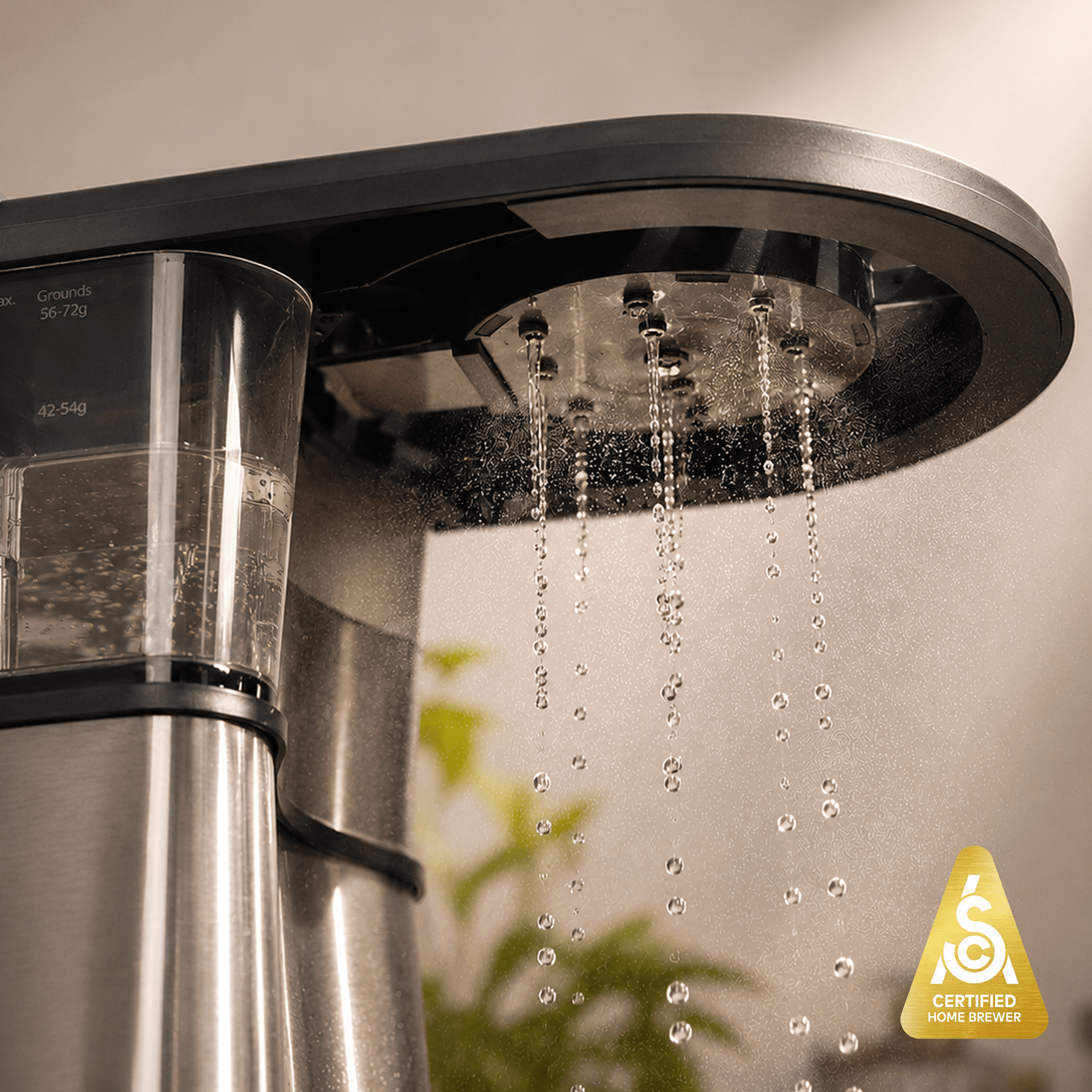 Bonavita Connoisseur 8-Cup Thermal Coffee Brewer with water dripping from the brew head.