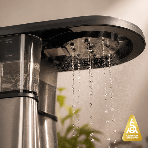 Bonavita Connoisseur 8-Cup Thermal Coffee Brewer with water dripping from the brew head.