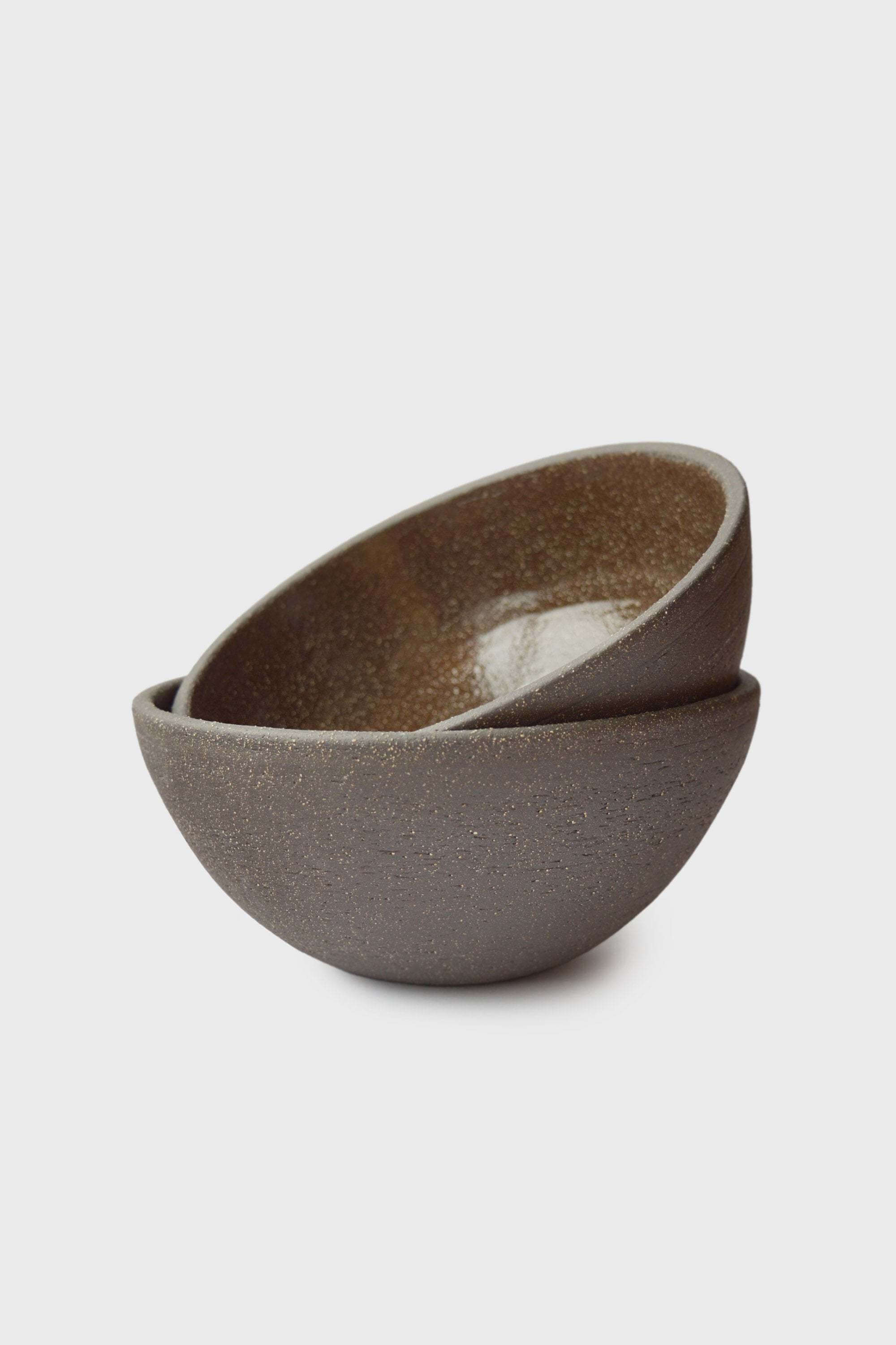 Handmade Dark Stoneware Bowl Pumpernickel Handmade dark stoneware serving bowl set, featuring rough exterior and glossy interior, perfect for kitchen use.