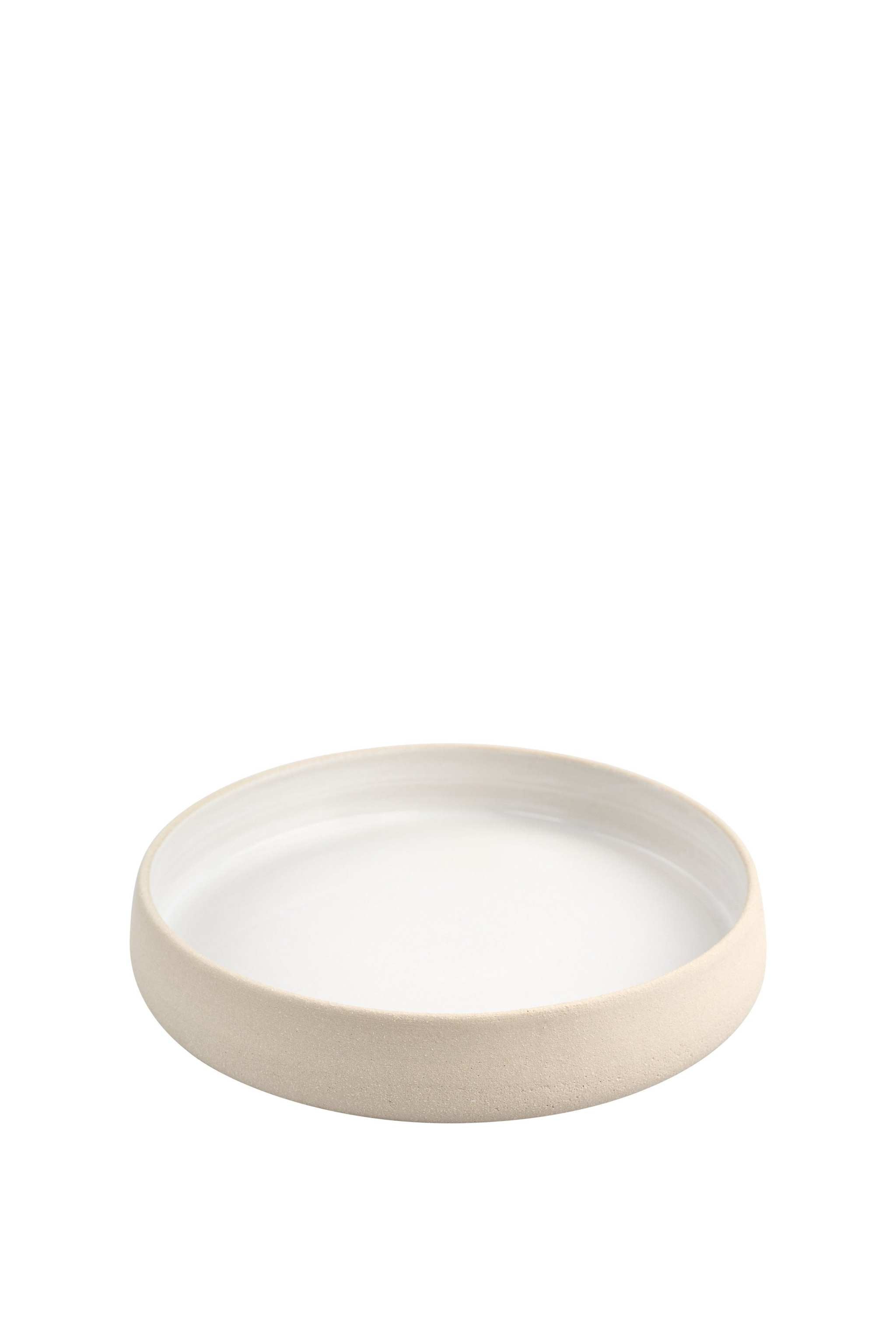 Handmade stoneware dinner plates with high sides, showcasing a smooth white glaze and textured exterior.