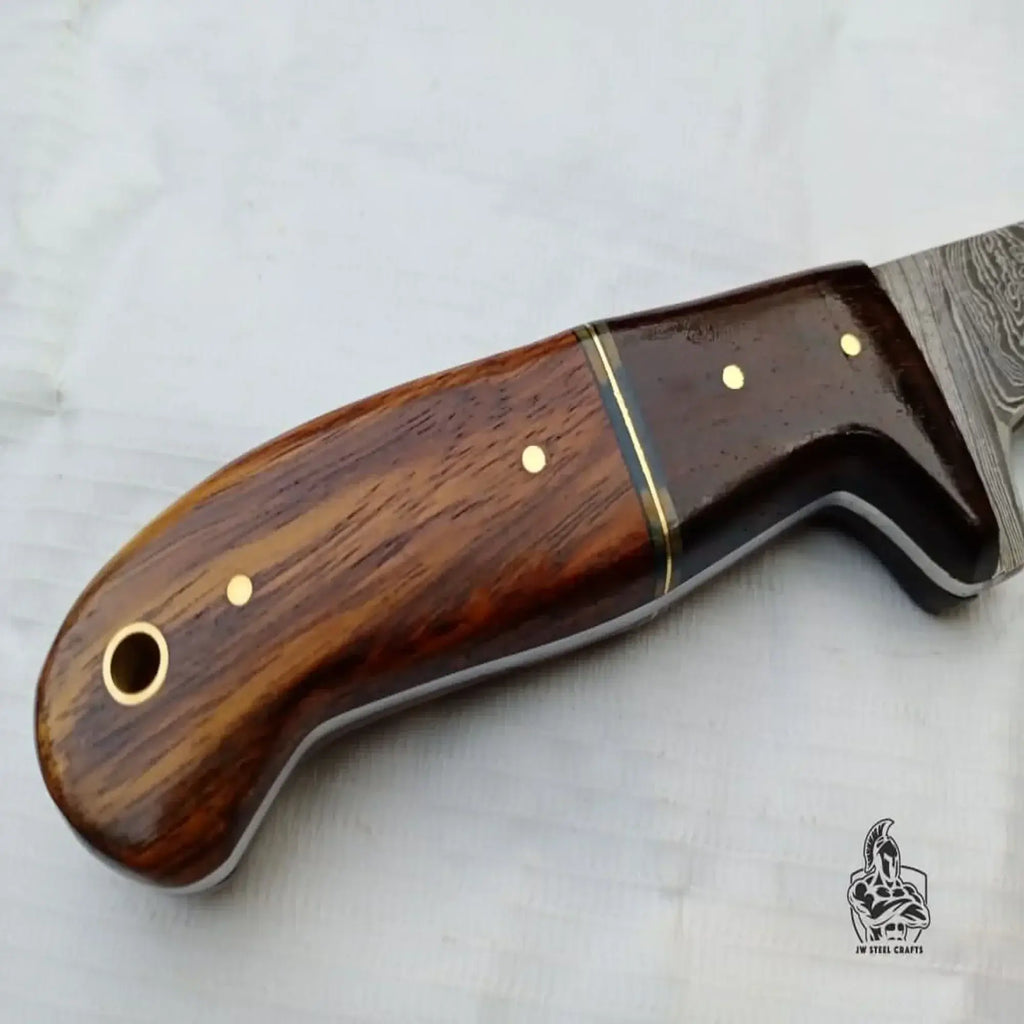 Handle of a custom made damascus fillet knife by JW SteelCrafts, showcasing fine craftsmanship and wooden design.
