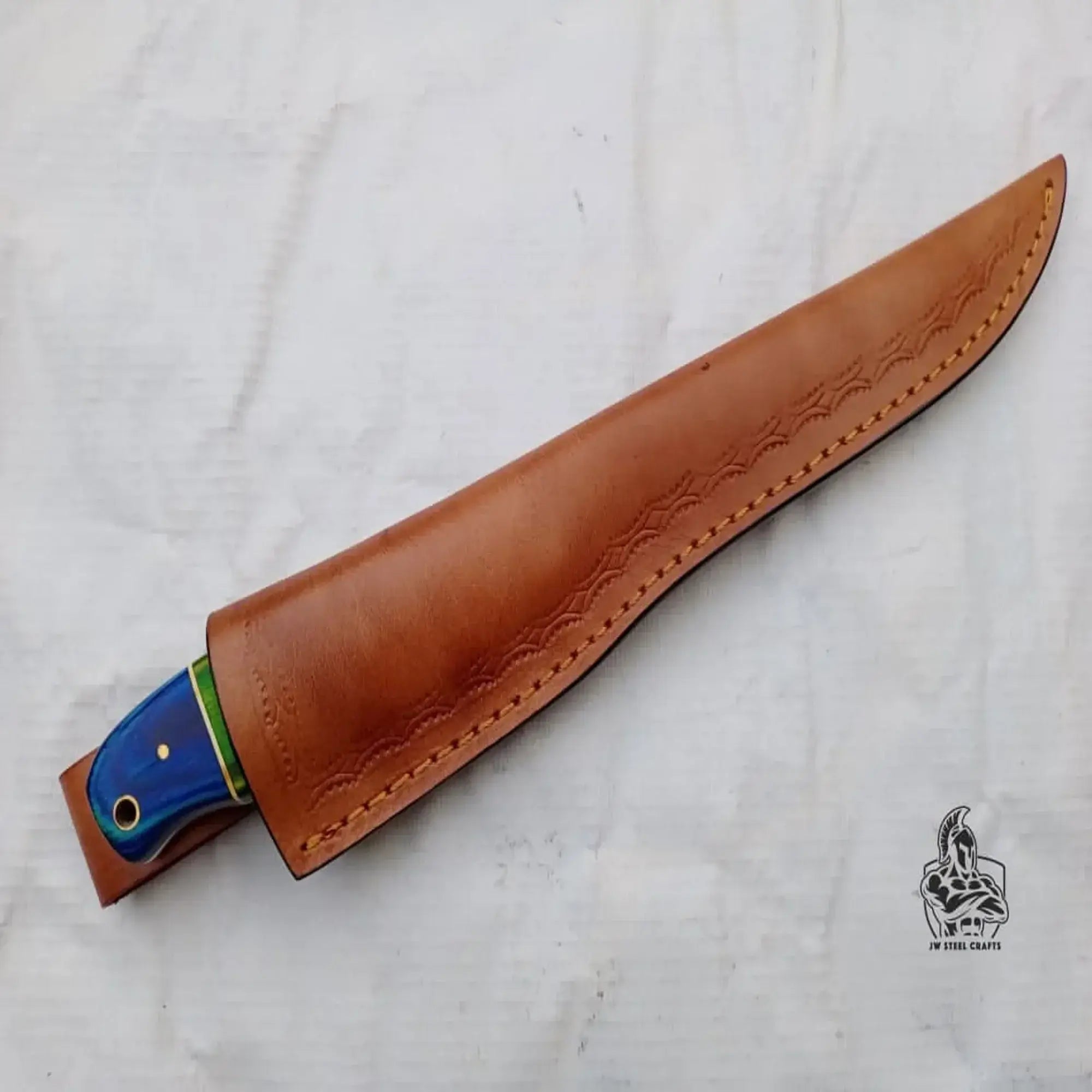 Handmade Damascus fillet knife in leather sheath, showcasing the colorful wood handle and precision blade design.