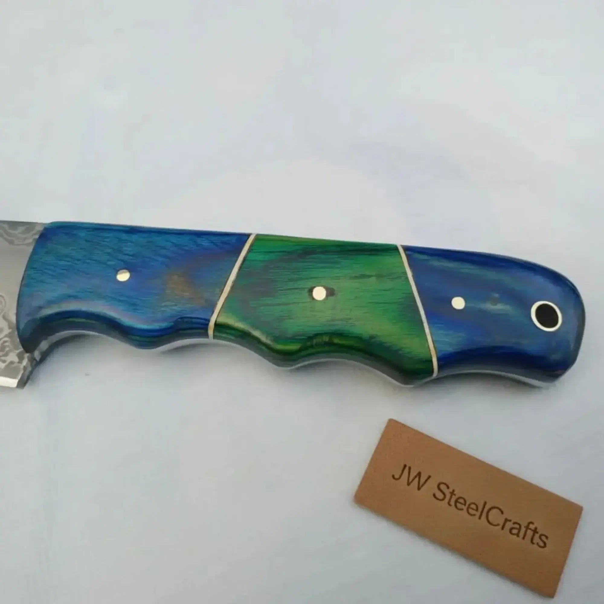 Damascus steel fillet knife featuring a two-tone blue and green wood handle by JW SteelCrafts.