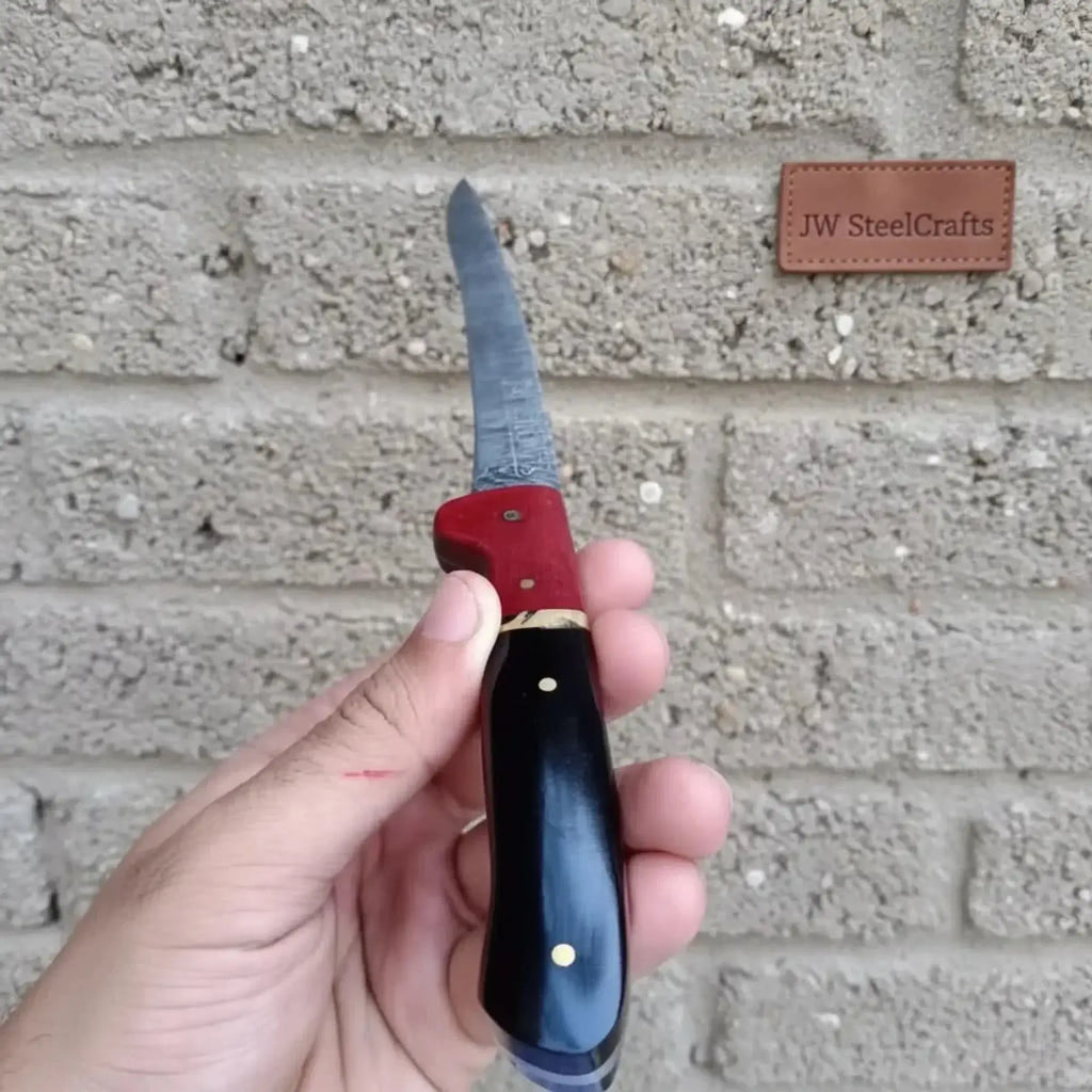 13-inch Damascus boning knife showcasing blue and red two-tone resin handle, steel bolster, and fine blade.