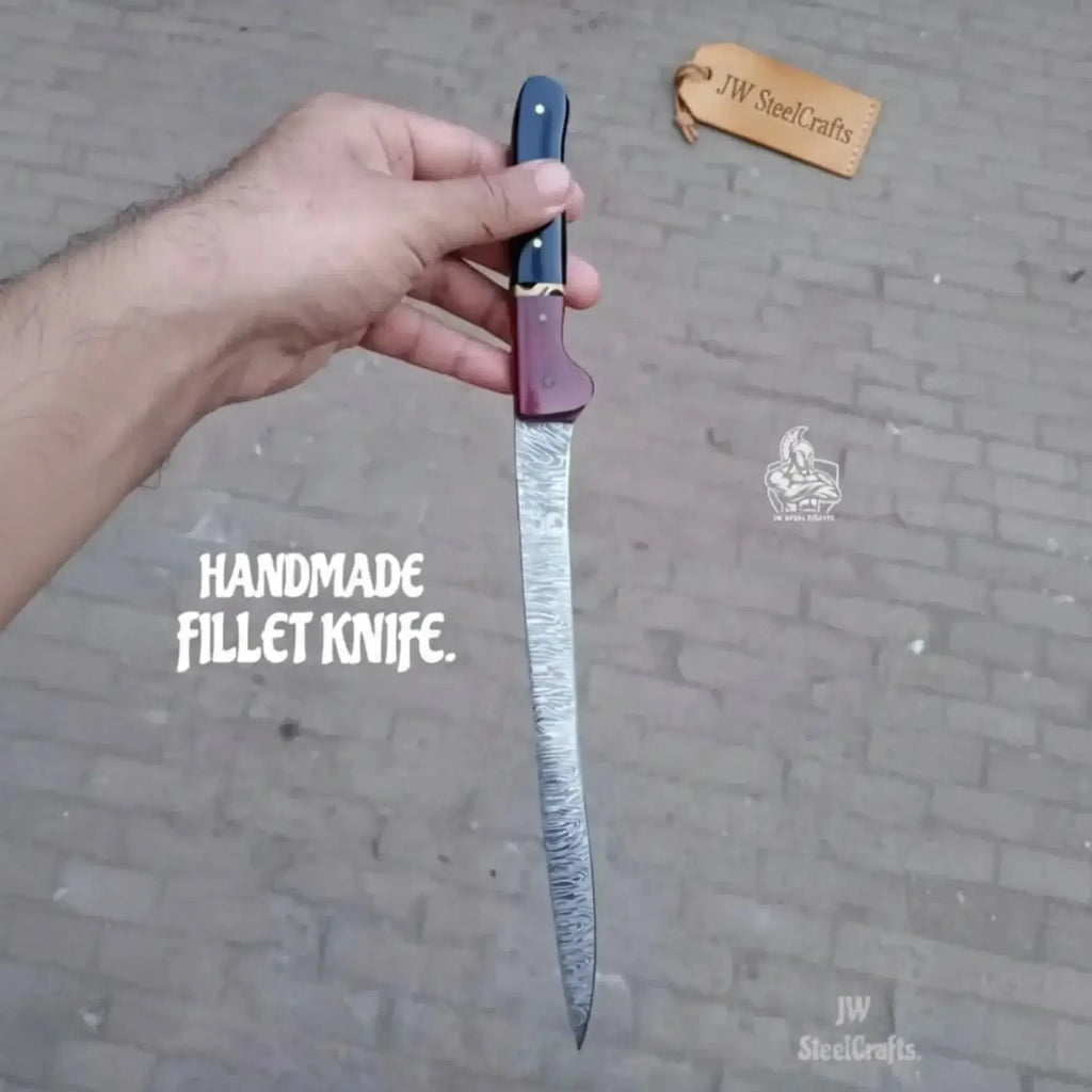 13-inch Damascus boning knife shown in hand with blue and red two-tone resin handle and handmade fillet knife features.