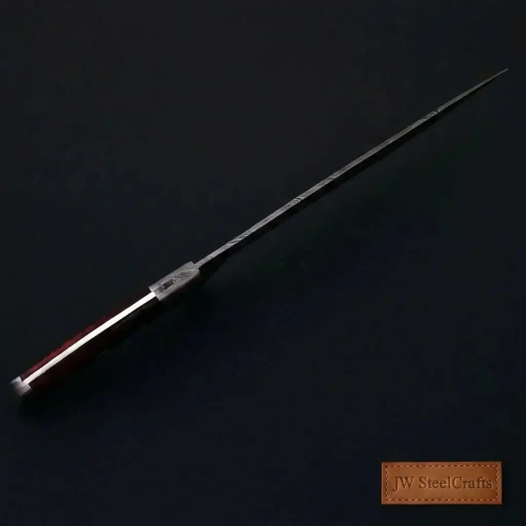 Handmade Damascus fillet knife with a hardwood handle and sleek design, ideal for precise fish cleaning.