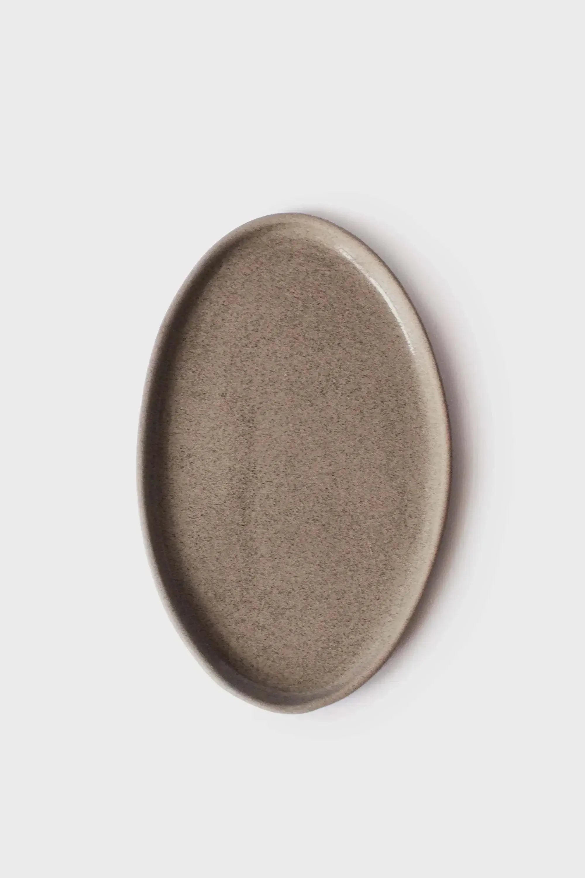 Handmade stoneware serving platter in a polished concrete-like finish, showcasing rustic elegance.