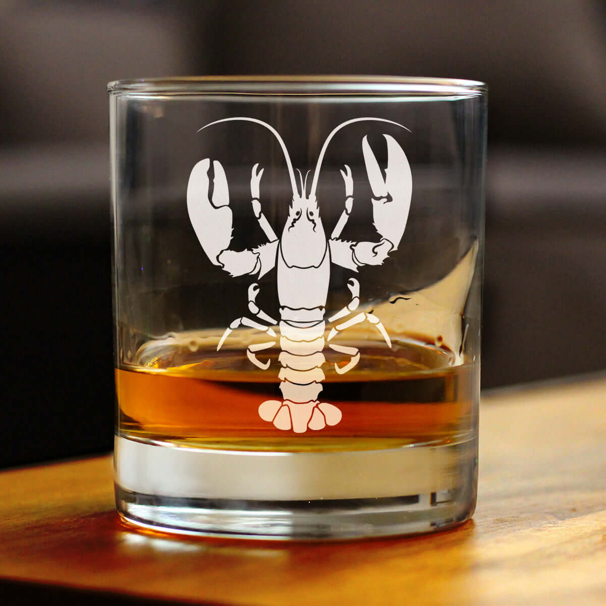 Lobster Engraved Rocks Glass with whiskey, intricately designed barware for coastal charm.