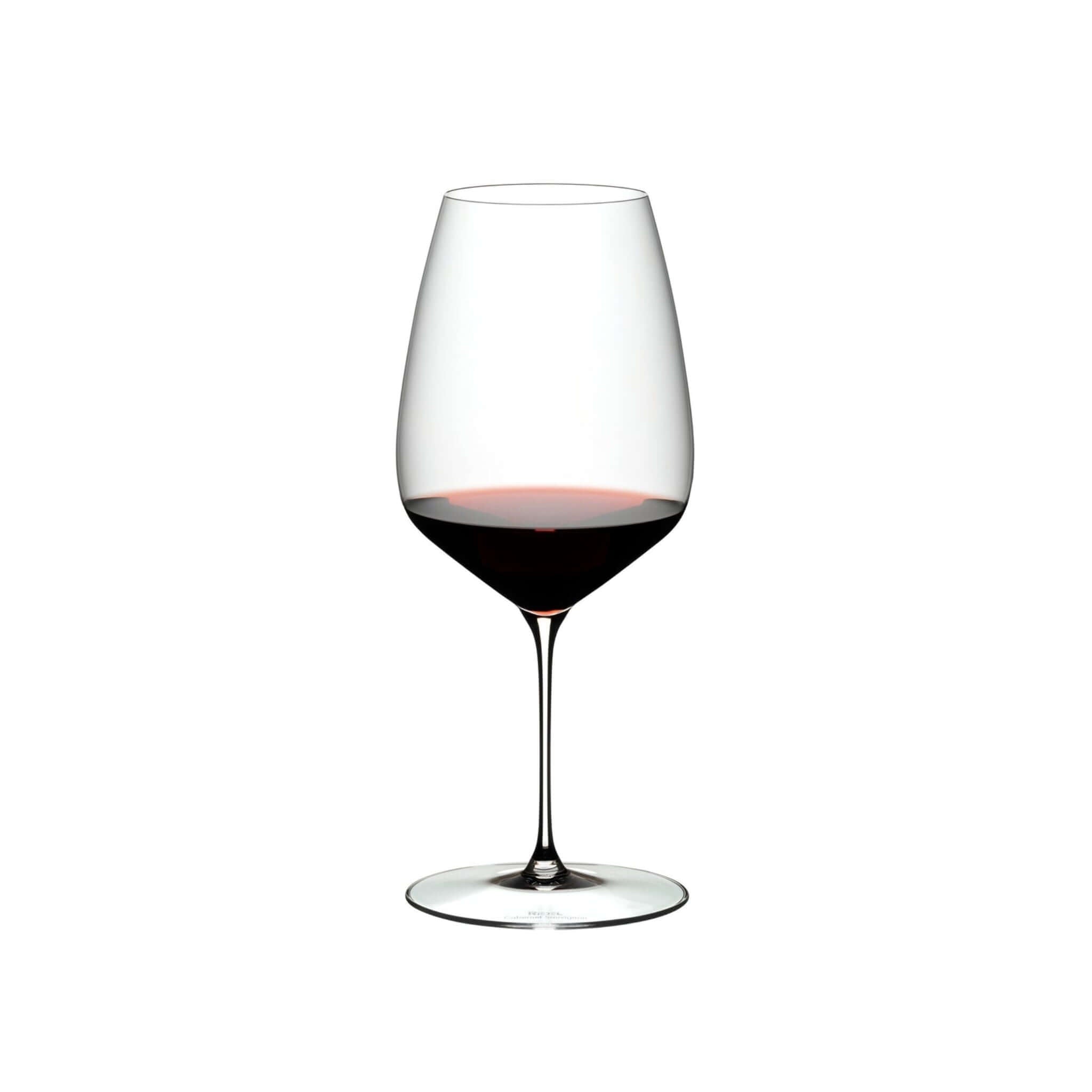 Riedel Veloce Cabernet wine glasses showcasing a red wine in a diamond-shaped bowl, ideal for enhancing bold flavors.