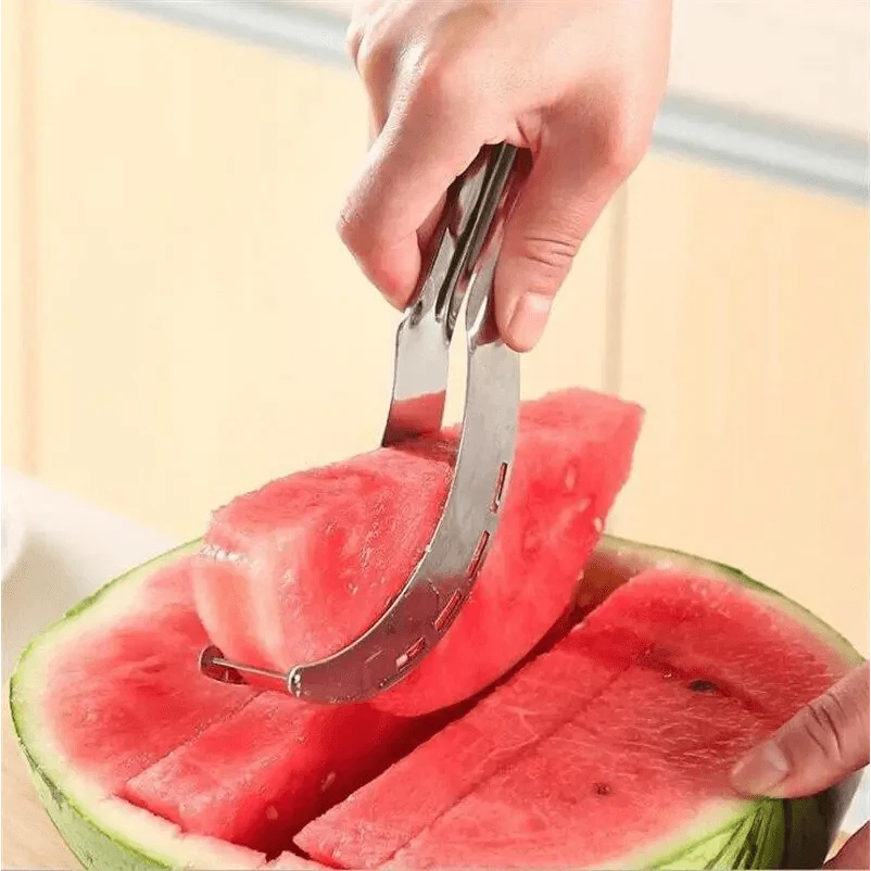 Stainless Steel Watermelon Slicer or Melon Baller, lifting a slice from a watermelon - Wine Drop Cookery LLC