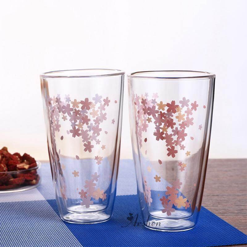 Sakura glass tea cup set featuring delicate cherry blossom design for elegant drinking experience.