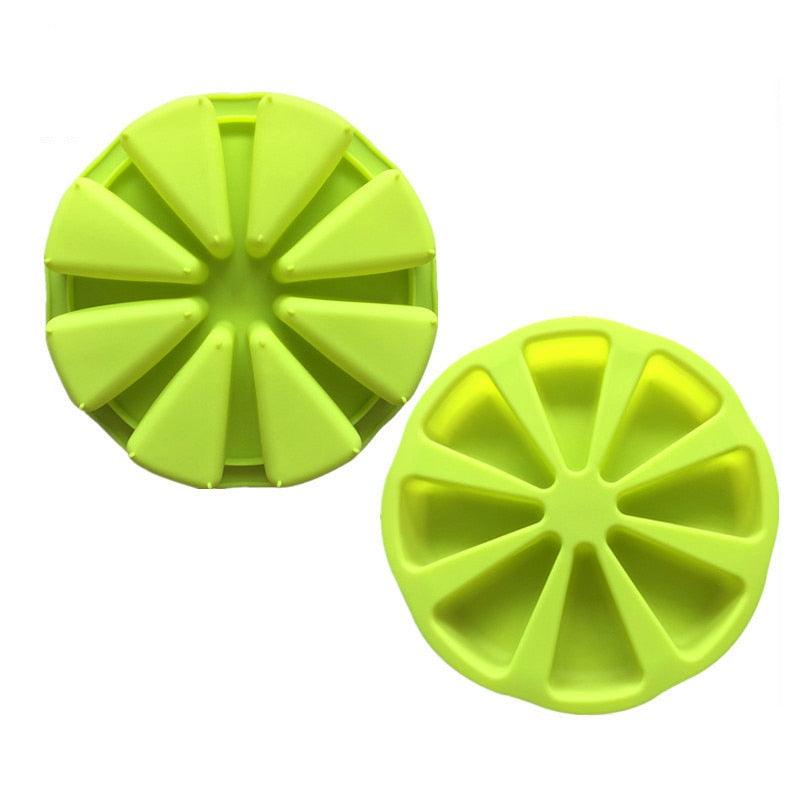 Two green silicone round molds on a white background