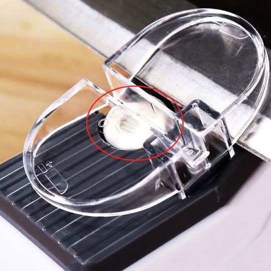 A blade being drawn through the electric sharpener