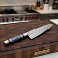 Raindrop Damascus chef knife with purple Pakka wood handle, brass spacer and steel pommel - Wine Drop Cookery LLC
